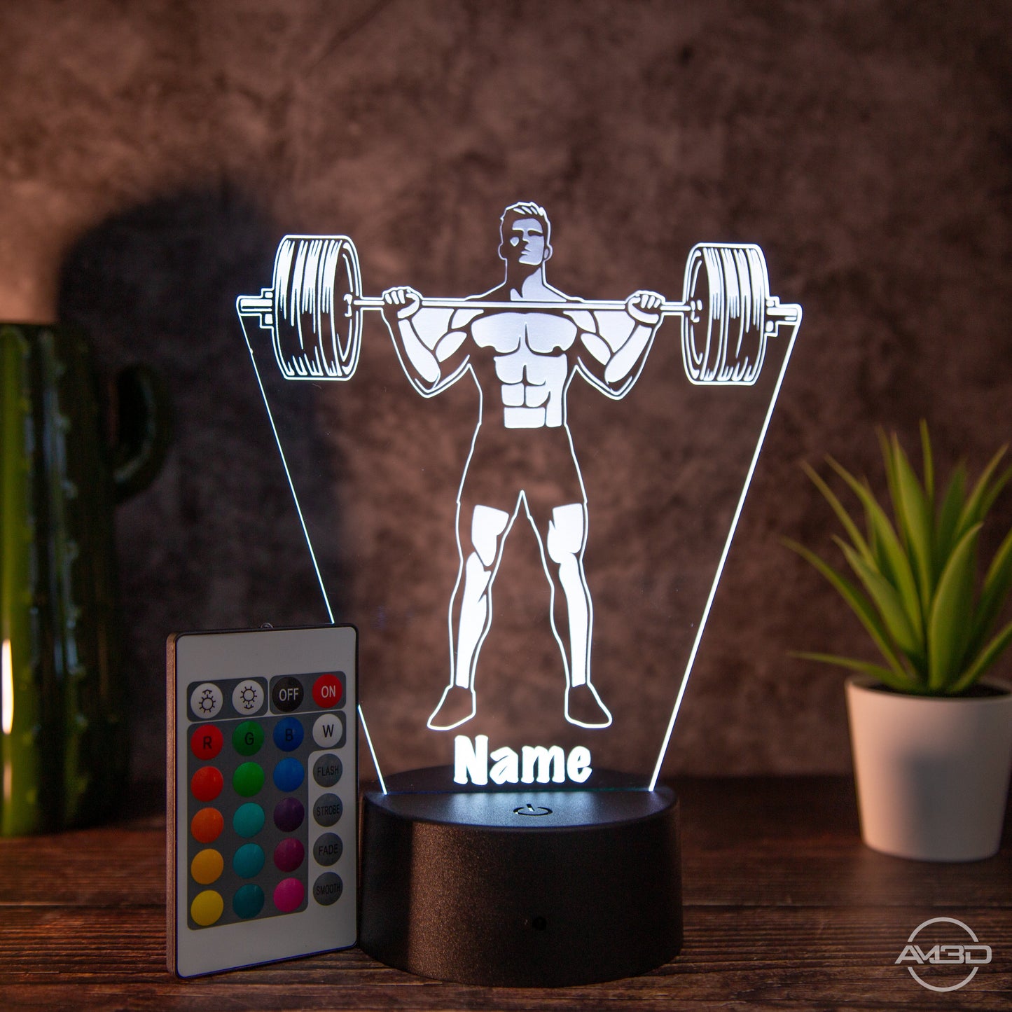 Personalisierbare LED Tischlampe aus Acryl "Gewichtheber" - AM3D Shopmit Kunststoffsockel